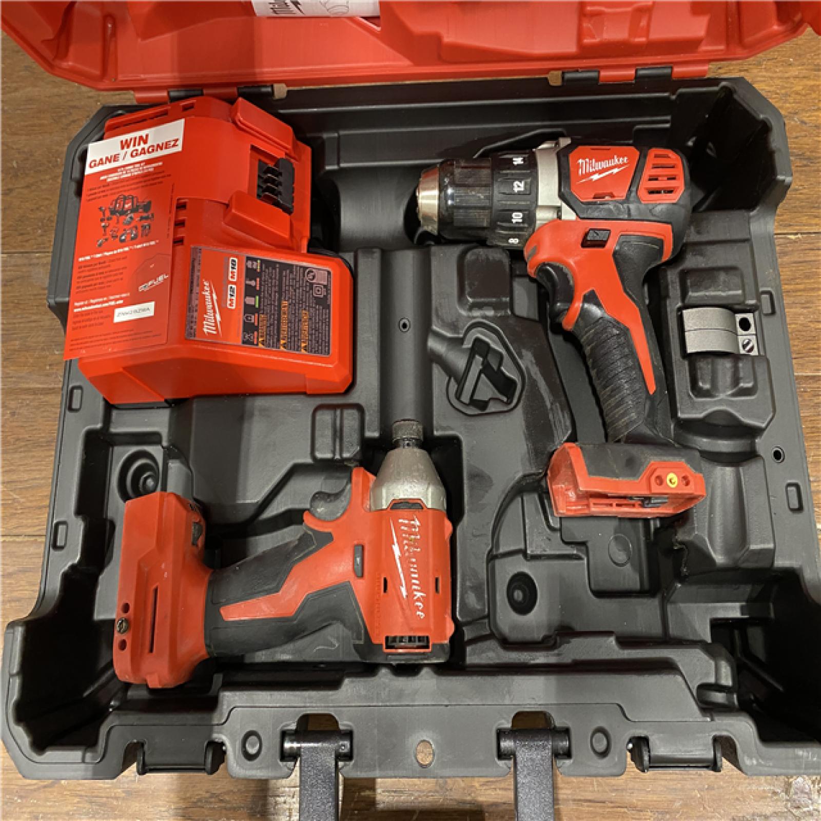 AS-IS MILWAUKEE M18 FUEL 18V Lithium-Ion Brushless Cordless Hammer Drill and Impact Driver Combo Kit (2-Tool) with 2 Batteries