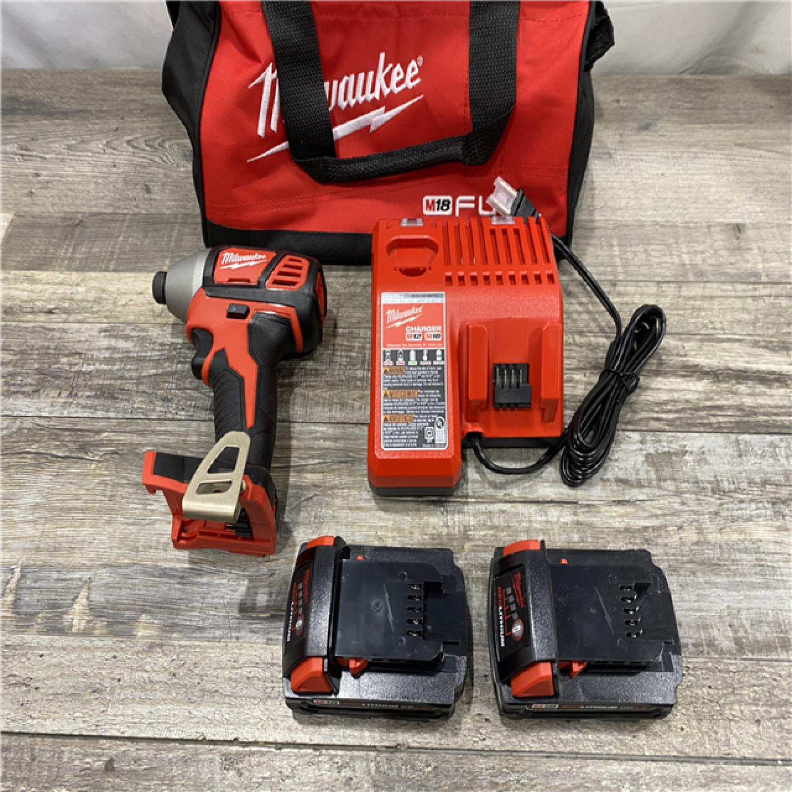 AS-IS Milwaukee 18V Lithium-Ion Cordless 1/4 in. Impact Driver Kit